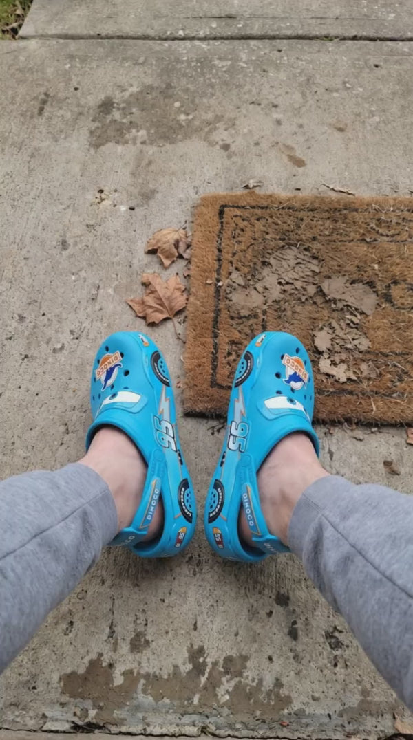 Customer wearing the Dinoco foam clog on a doorstep