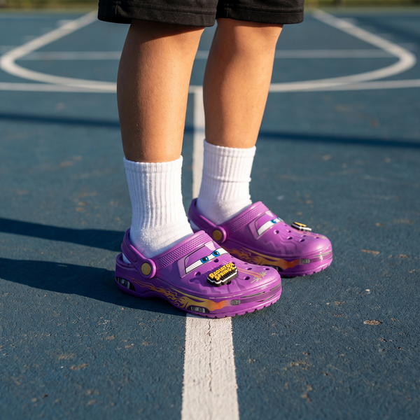 Purple flame SYDZ foam clogs worn on a basketball court